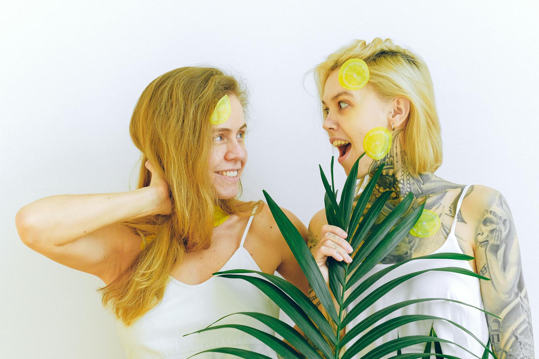 Two people smiling and holding fresh lemons, expressing joy and comfort during recovery
